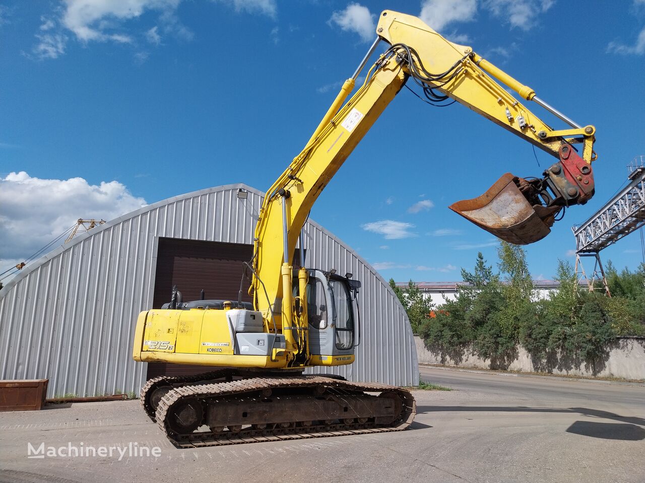 pelle de manutention New Holland E215B